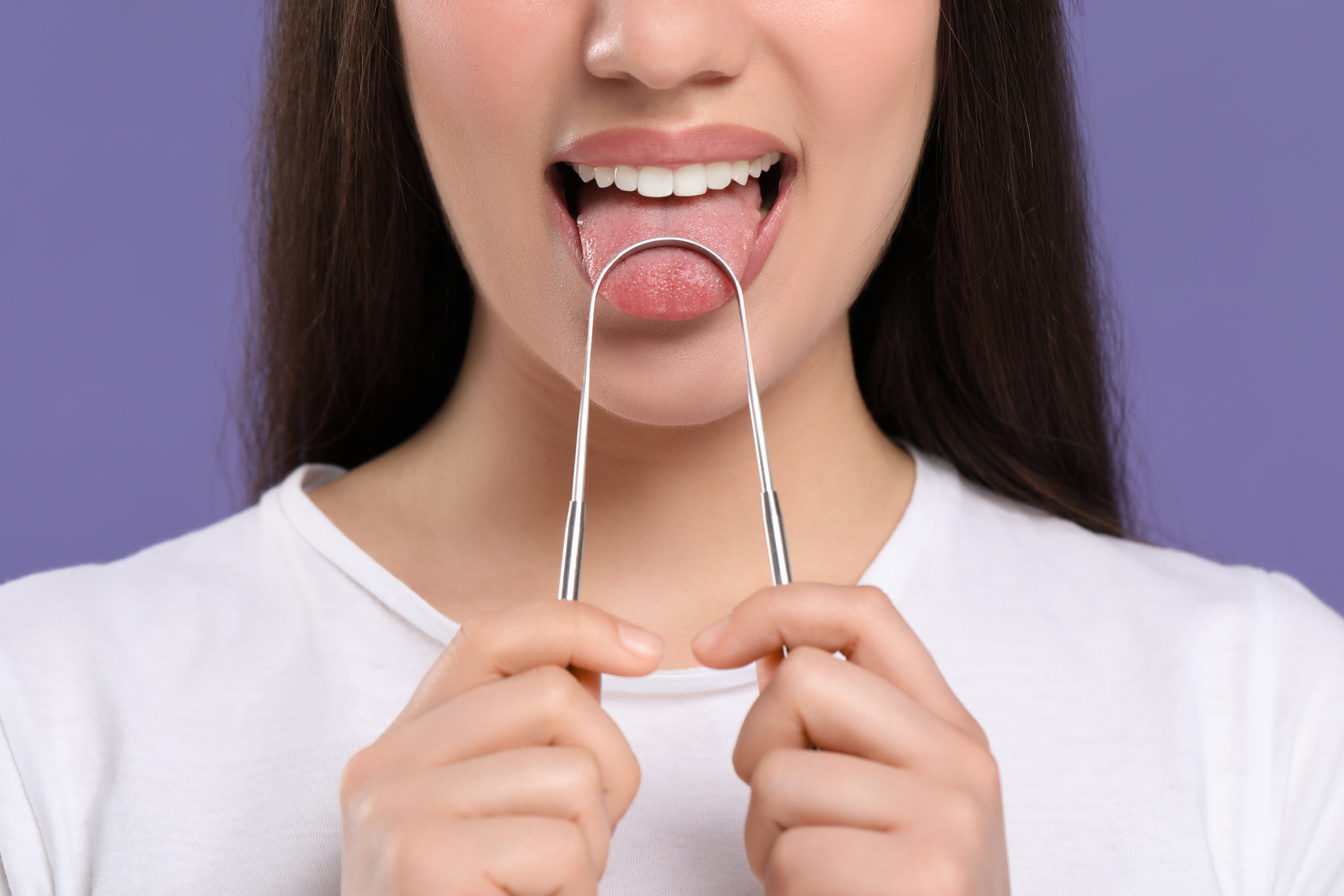 Woman Brushing Her Tongue with Cleaner on Violet Background, Clo